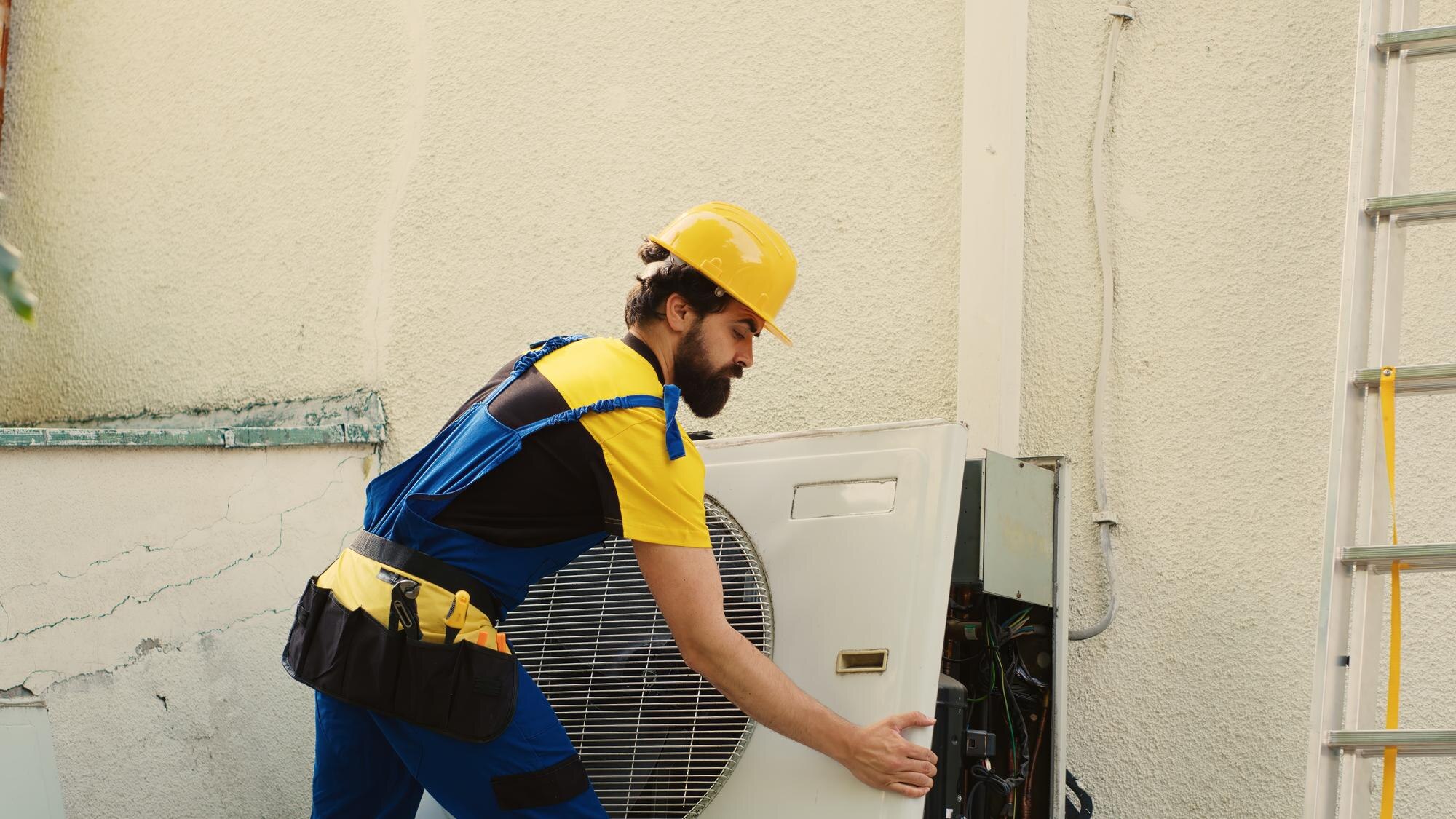technician-dismantling-condenser_482257-90835