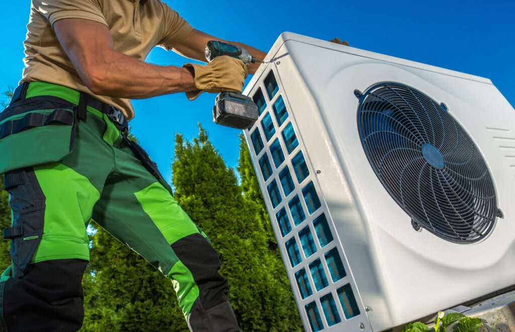 HVAC Technician Installing Heat Pump