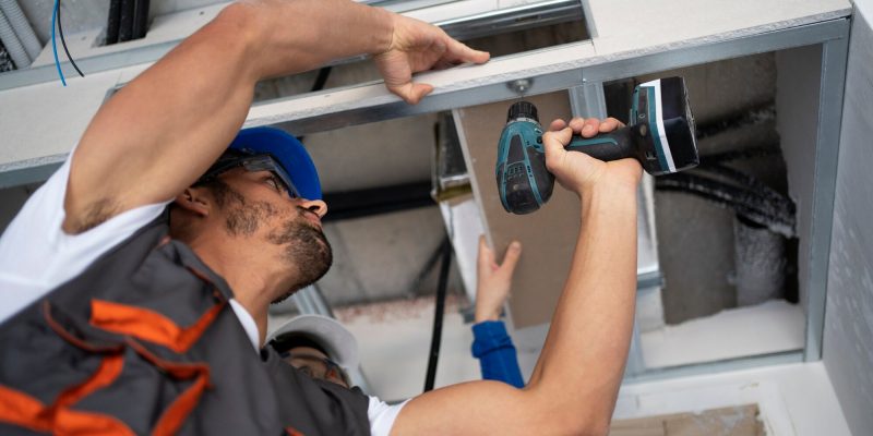 low-angle-people-working-with-drill_23-2149366670